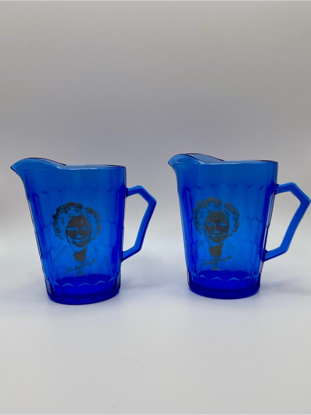 Blue Glass Pitcher Pair with Vintage Portrait of Shirley Temple
